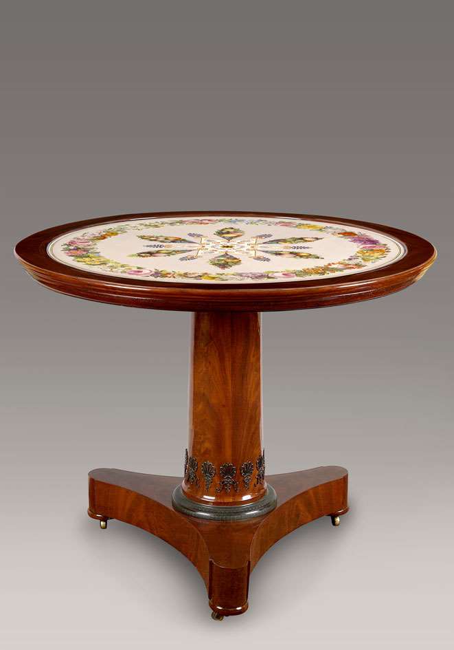A Restauration mahogany gueridon with original “lave emailee” table top